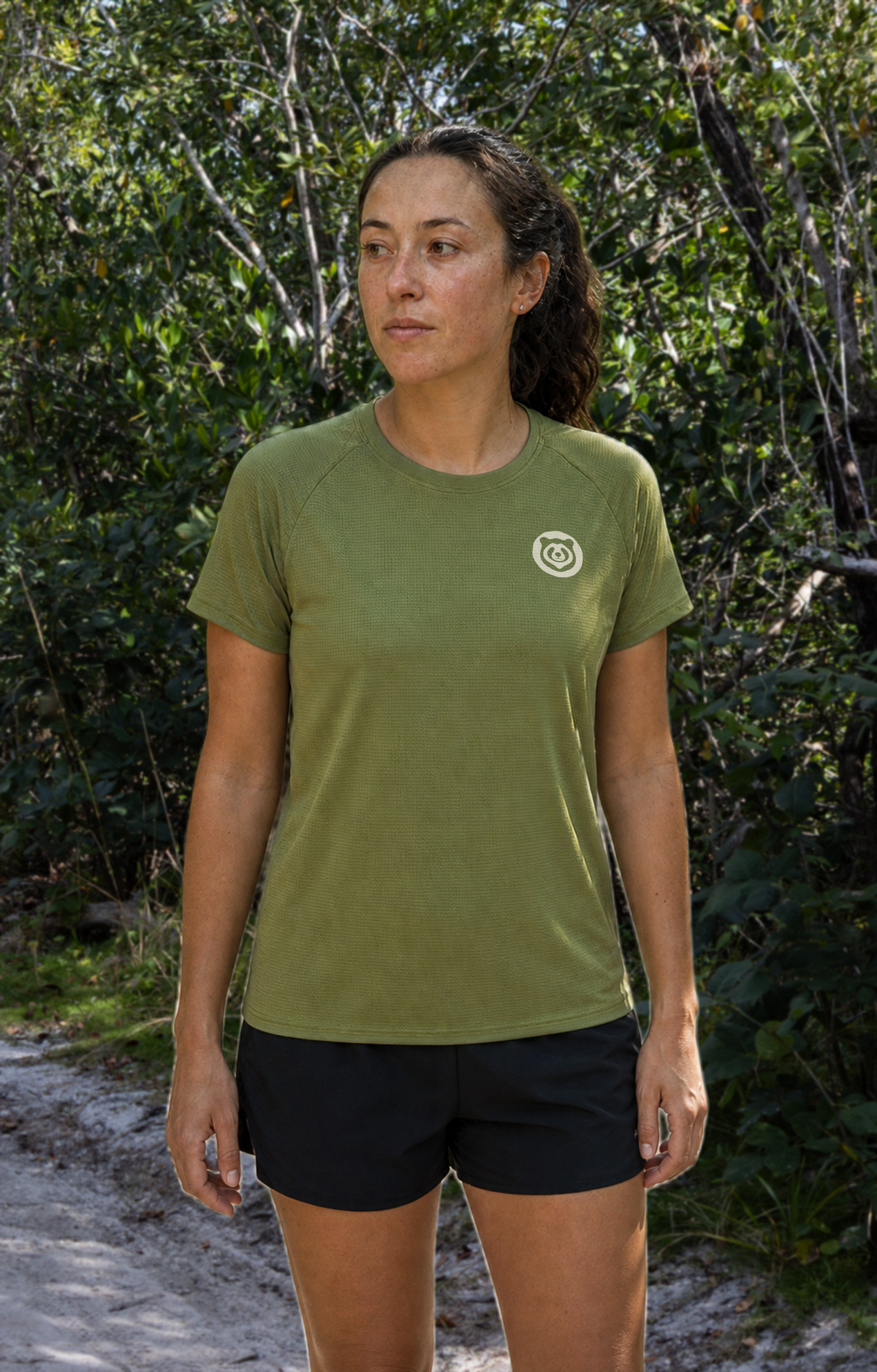 Women’s Fern Green MIAMI HAS TRAILS Trail Tee on a model, front view with Bearly Runners chest logo.